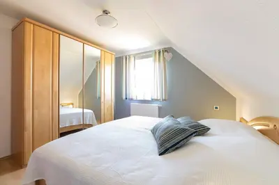 Ein Bett oder Betten in einem Zimmer der Unterkunft Hoppenberg 5a