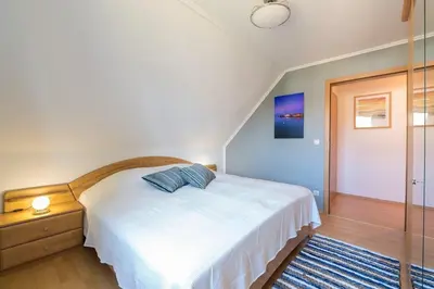 Ein Bett oder Betten in einem Zimmer der Unterkunft Hoppenberg 5a