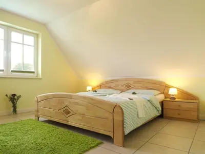Ein Bett oder Betten in einem Zimmer der Unterkunft Grüner Winkel 32a