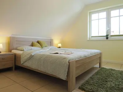 Ein Bett oder Betten in einem Zimmer der Unterkunft Grüner Winkel 32a