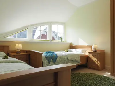 Ein Bett oder Betten in einem Zimmer der Unterkunft Grüner Winkel 32a