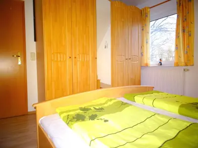 Ein Bett oder Betten in einem Zimmer der Unterkunft Birkenstraße 6j