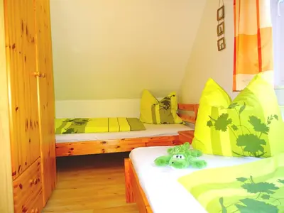 Ein Bett oder Betten in einem Zimmer der Unterkunft Birkenstraße 6j