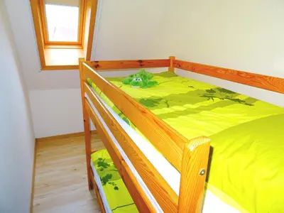 Ein Bett oder Betten in einem Zimmer der Unterkunft Birkenstraße 6j