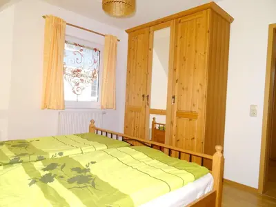 Ein Bett oder Betten in einem Zimmer der Unterkunft Birkenstraße 6K