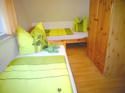 Ein Bett oder Betten in einem Zimmer der Unterkunft Birkenstraße 6K