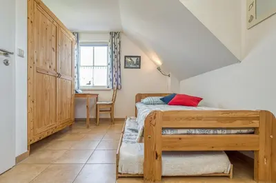 Ein Bett oder Betten in einem Zimmer der Unterkunft Kavelweg 4