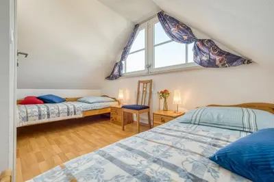 Ein Bett oder Betten in einem Zimmer der Unterkunft Kavelweg 4