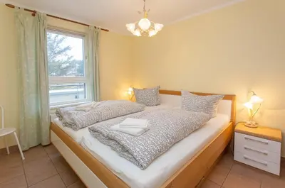 Ein Bett oder Betten in einem Zimmer der Unterkunft Ostseeresidenz - Whg 29
