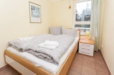 Ein Bett oder Betten in einem Zimmer der Unterkunft Ostseeresidenz - Whg 29