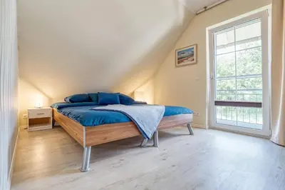Ein Bett oder Betten in einem Zimmer der Unterkunft Huus Jette