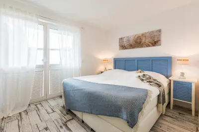 Ein Bett oder Betten in einem Zimmer der Unterkunft Whg 10 - Laura