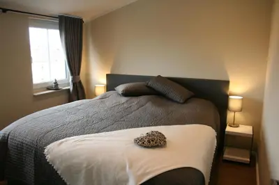 Ein Bett oder Betten in einem Zimmer der Unterkunft Whg 17 - De Mügg