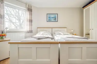 Ein Bett oder Betten in einem Zimmer der Unterkunft Friedenstraße 7 Whg 4