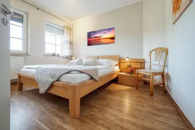 Ein Bett oder Betten in einem Zimmer der Unterkunft Friedenstraße 7 Whg 4