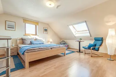 Ein Bett oder Betten in einem Zimmer der Unterkunft Sommerwind Whg 3