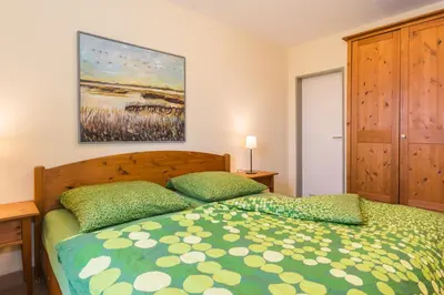 Ein Bett oder Betten in einem Zimmer der Unterkunft Ostseeresidenz - Whg 14