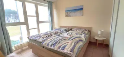 Ein Bett oder Betten in einem Zimmer der Unterkunft Ostseeresidenz - Whg 17