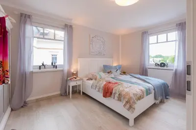 Ein Bett oder Betten in einem Zimmer der Unterkunft Hafenstraße 27 Ankerplatz 4