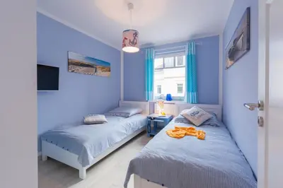 Ein Bett oder Betten in einem Zimmer der Unterkunft Hafenstraße 27 Ankerplatz 4