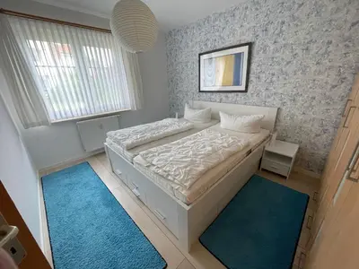 Ein Bett oder Betten in einem Zimmer der Unterkunft Friedenstraße 21 Whg 1