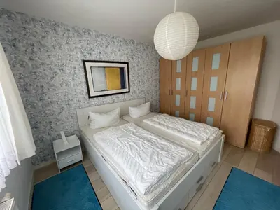 Ein Bett oder Betten in einem Zimmer der Unterkunft Friedenstraße 21 Whg 1
