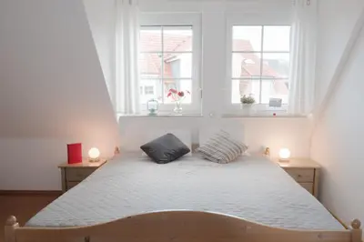 Ein Bett oder Betten in einem Zimmer der Unterkunft Friedenstraße 21 Whg 4