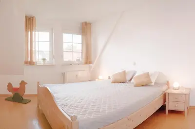Ein Bett oder Betten in einem Zimmer der Unterkunft Friedenstraße 21 Whg 4
