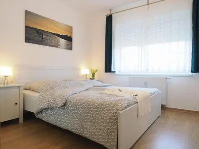 Ein Bett oder Betten in einem Zimmer der Unterkunft Alte Reihe 10 - Silbermöwe 1