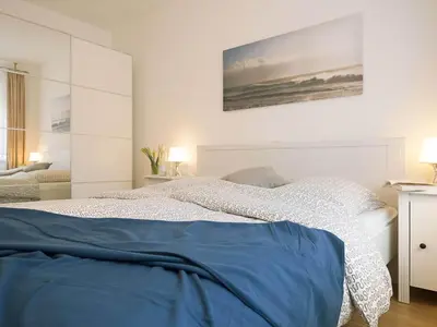 Ein Bett oder Betten in einem Zimmer der Unterkunft Alte Reihe 10 - Silbermöwe 2