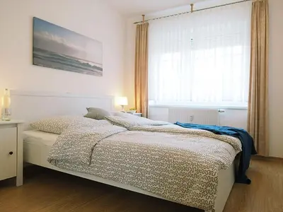 Ein Bett oder Betten in einem Zimmer der Unterkunft Alte Reihe 10 - Silbermöwe 2