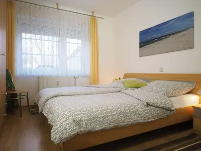 Ein Bett oder Betten in einem Zimmer der Unterkunft Alte Reihe 10 - Silbermöwe 3