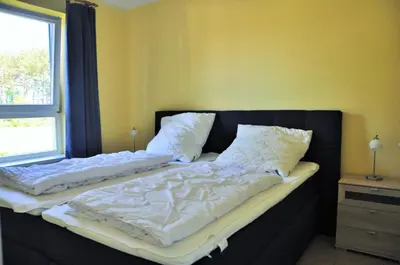 Ein Bett oder Betten in einem Zimmer der Unterkunft Ostseeresidenz - Whg 19