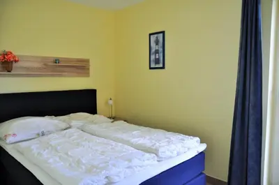 Ein Bett oder Betten in einem Zimmer der Unterkunft Ostseeresidenz - Whg 19