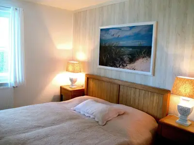 Ein Bett oder Betten in einem Zimmer der Unterkunft Sonneneck - Kavelweg 10 Whg 1