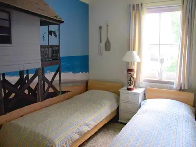 Ein Bett oder Betten in einem Zimmer der Unterkunft Sonneneck - Kavelweg 10 Whg 1