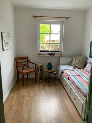 Ein Bett oder Betten in einem Zimmer der Unterkunft Ferienhaus Schiffchen 