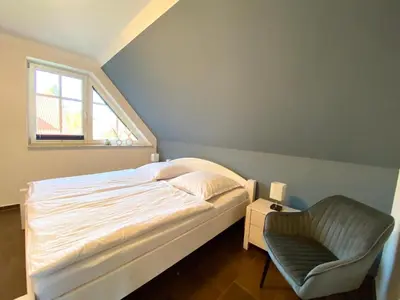 Ein Bett oder Betten in einem Zimmer der Unterkunft Die Kleine Ferienwohnung