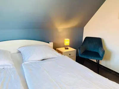 Ein Bett oder Betten in einem Zimmer der Unterkunft Die Kleine Ferienwohnung