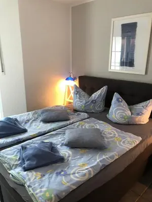 Ein Bett oder Betten in einem Zimmer der Unterkunft Strandmuschel