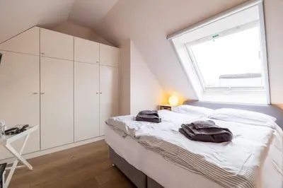Ein Bett oder Betten in einem Zimmer der Unterkunft Ostseeidyll