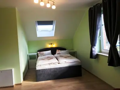 Ein Bett oder Betten in einem Zimmer der Unterkunft Haus Kranichweide