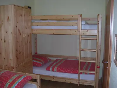 Ein Bett oder Betten in einem Zimmer der Unterkunft Reiseoase Kavelweg 10, Whg 2