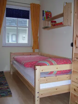 Ein Bett oder Betten in einem Zimmer der Unterkunft Reiseoase Kavelweg 10, Whg 2