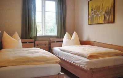 Ein Bett oder Betten in einem Zimmer der Unterkunft 2 Bedroom Cozy Home In Fuhlendorf