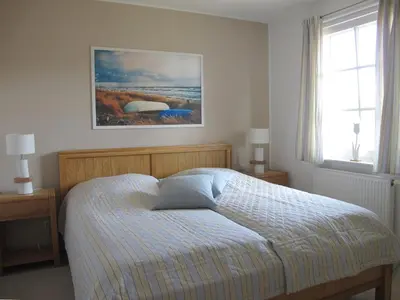 Ein Bett oder Betten in einem Zimmer der Unterkunft Wiesenstraße 55 Whg 1 - Meeresbrise