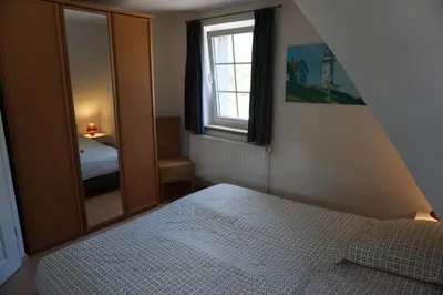Ein Bett oder Betten in einem Zimmer der Unterkunft Kranich