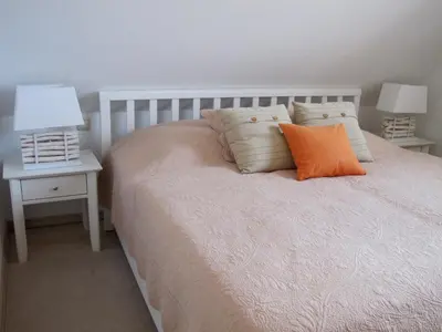 Ein Bett oder Betten in einem Zimmer der Unterkunft Wiesenstraße 55 Whg 2 - Strandbuhne