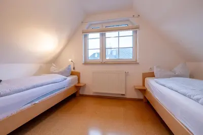 Ein Bett oder Betten in einem Zimmer der Unterkunft Strandglück 3