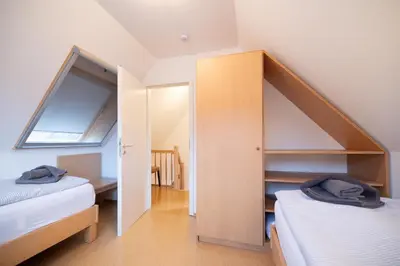 Ein Bett oder Betten in einem Zimmer der Unterkunft Strandglück 3